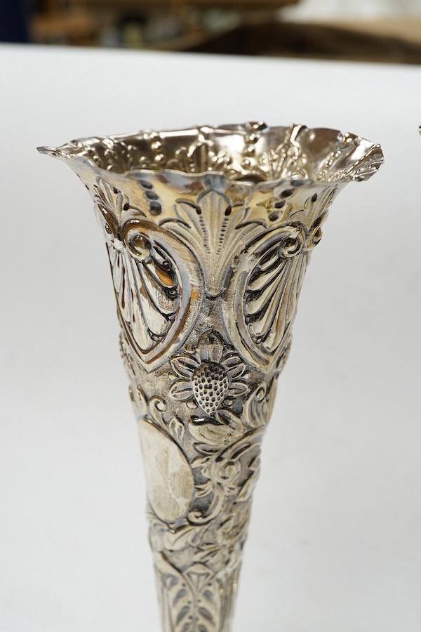 A pair of late Victorian repousse silver trumpet vase, Charles Boyton II, London, 1892/3, 20.3cm, weighted. Condition - poor